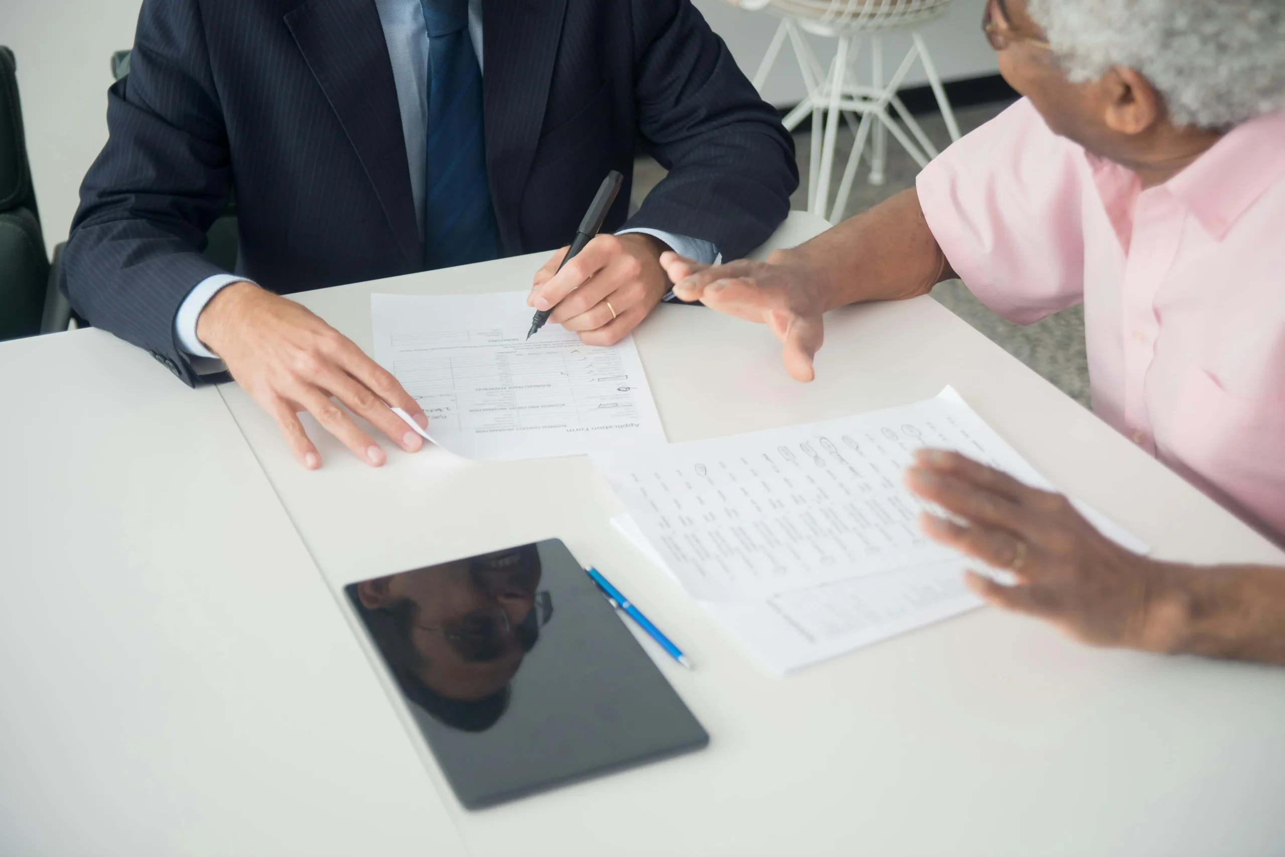 Consultant reviewing social insurance documents with client